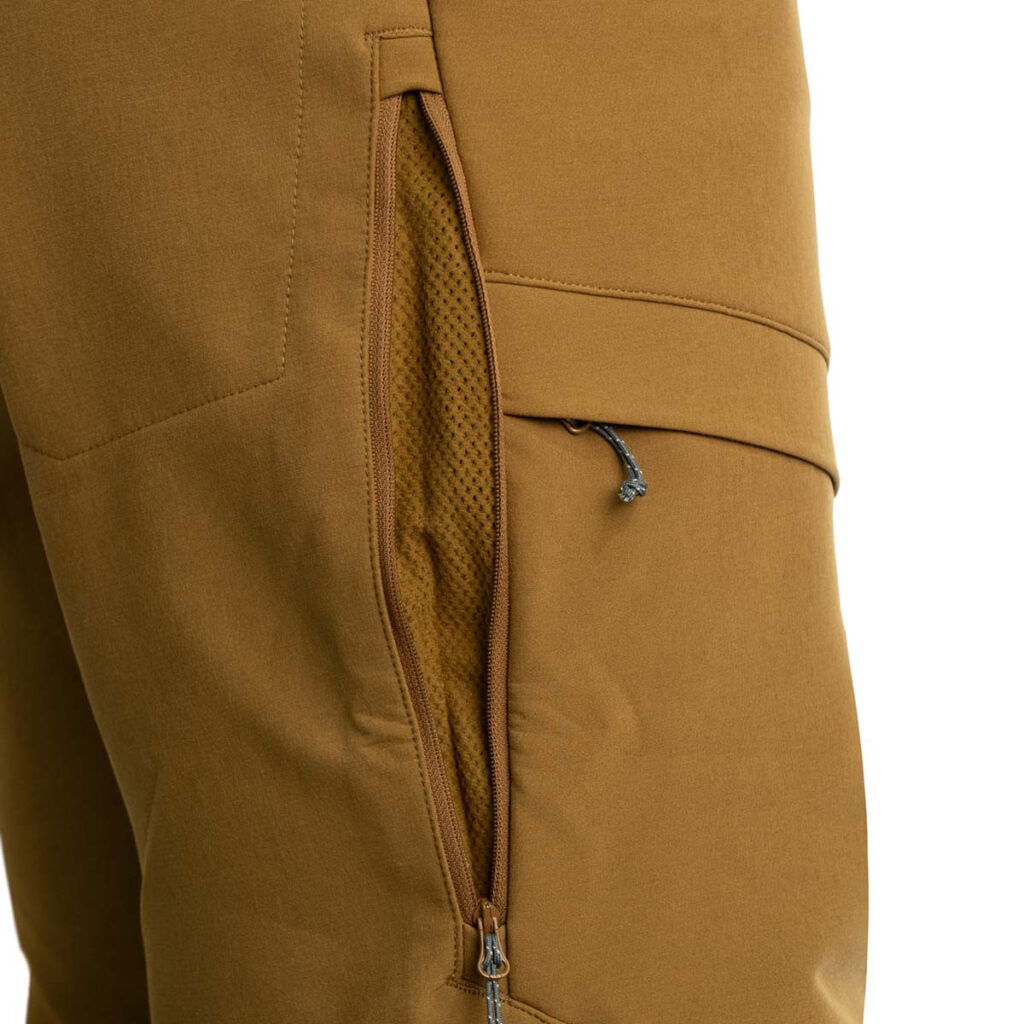 The new Softshell Pant is perfectly engineered with tech-savvy features including side seam vent zippers that can be opened for cooling down when midday temps peak, or during laborious hikes in and out. The gusseted crotch and articulated knees offer outs